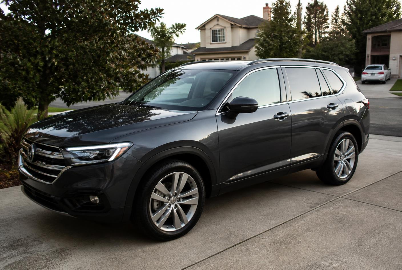 Freshly detailed SUV with glossy clean paint in a driveway